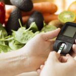 Diabetes monitor, diet and healthy food eating nutritional concept with clean fruits and vegetables with diabetic measuring tool kit