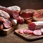 Various kind types of salami, speck and sausages