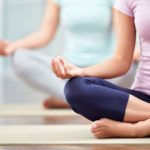 Young people doing yoga