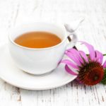 Cup of tea  with purple echinacea
