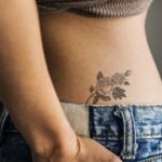 Closeup of lower hip tattoo of a woman