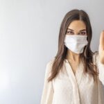 Girl with mask to protect her from Corona virus.