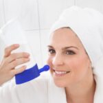 Young Woman Cleaning Nose