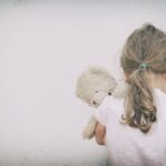 Little girl crying in the corner.