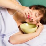 Woman flushing her nose.