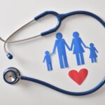 Concept of family medicine with ostetoscope and paper cut