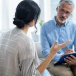 Therapist consoling a woman